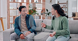 Couple, divorce and argument, fight or talking in marriage crisis at home on living room sofa. Asian man, woman and