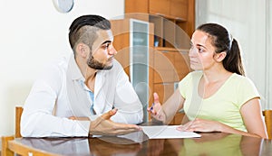 Couple with documents in apartment