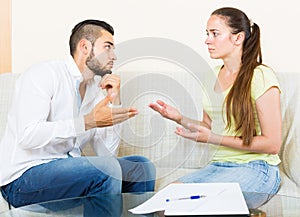 Couple with documents in apartment