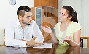 Couple with documents in apartment