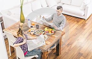 Couple doing breakfast at home