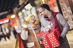 Couple doing Christmas shopping in the city