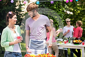 Couple doing grill party