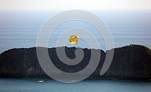 Couple doing parasailing at Manuel Antonio national park beach in Costa Rica, most beautiful beaches in the world.