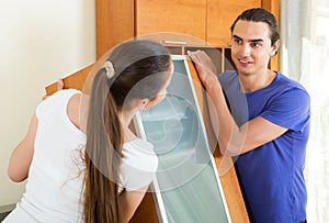 Couple doing relocation of furniture