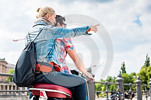 Couple doing a scooter trip in Berlin
