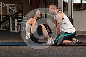 Couple Doing Sit-Ups Abdominal Crunch