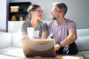 Couple Doing Taxes And Family Budget