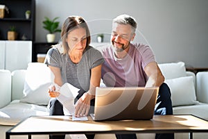 Couple Doing Taxes And Family Budget