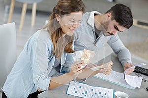 Couple doing their accounts and counting banknotes