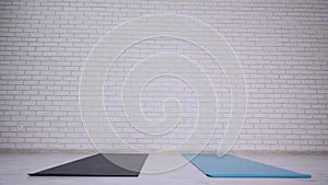 Couple doing yoga in studio