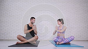 Couple doing yoga in studio