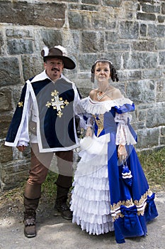 Couple dressed up as a 17th century French musketeer and noble lady during the New France Festival