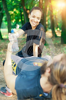 Couple drink water after exercise