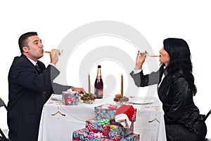 Couple drinking champagne at Christmas table