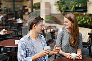 Couple Drinking Coffee In Cafe