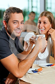 Couple drinking coffee in cafe