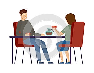 Couple is drinking coffee in a cafe. Lunch break. Man and woman