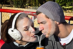 Couple Drinking A Juice Out Of A Can