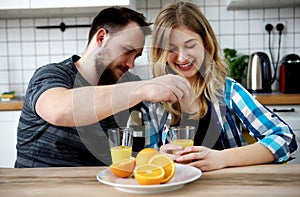 Couple drinking orange juice