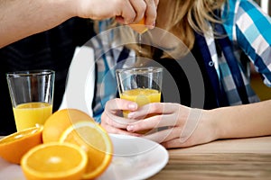 Couple drinking orange juice