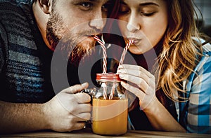 Couple drinking orange juice