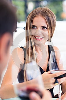 Couple drinking red wine in restaurant