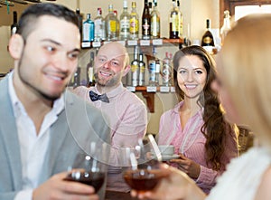 Couple drinking wine at bar