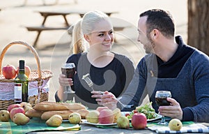 Couple drinking wine at table