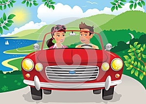 Couple driving along coastal road