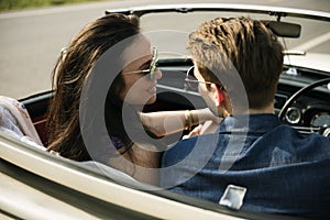 Couple Driving a Car Traveling on Road Trip Together