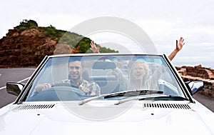 Couple, driving and convertible or excited or travel on mountain road or weekend trip, adventure or journey. Man, woman