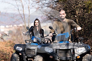 Couple Driving Off-road With Quad Bike or Atv