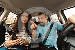 Couple Driving Using Cellphone Sitting In New Automobile