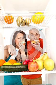 Couple eating cakes