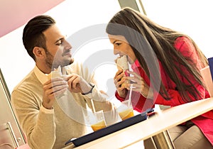 Couple eating in fast food restaurant