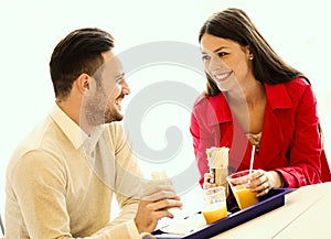 Couple eating in fast food restaurant