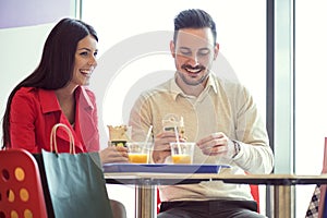 Couple eating in fast food restaurant