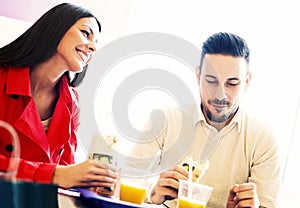 Couple eating in fast food restaurant