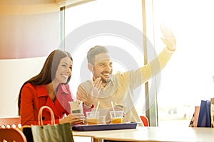 Couple eating in fast food restaurant