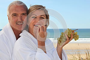Couple eating grapes