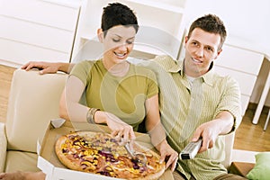 Couple eating pizza