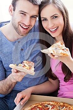 Couple eating pizza