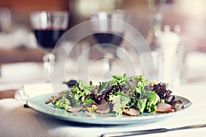 Couple eating romantic Dinner in a gourmet restaurant drinking wine and eating