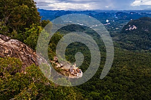 Couple at the edge of a mountain, Dragon Crest mountain Krabi Thailand