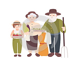 Couple of elderly farmers and their grandchild holding ripe gathered vegetables. Grandparents and grandson carry harvest