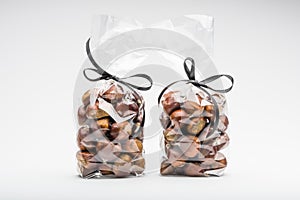 Couple of elegant plastic bags of fresh chestnuts for gift