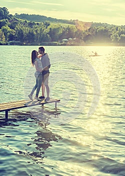 Couple embrace on the pier