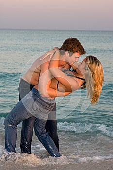 Couple Embrace In The Surf