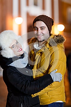 Couple embracing background of city